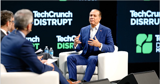 David Khorram speaking onstage at TechCrunch Disrupt